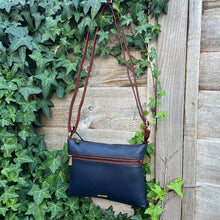 Load image into Gallery viewer, Nova Leather Two-Tone Slim Crossbody Bag – Navy & Tan (hanging)