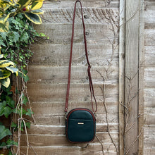 Load image into Gallery viewer, Dark Green &amp; Tan Leather &#39;Poppy&#39; Oval Shaped Twin Zip Top Crossbody Bag (hanging)
