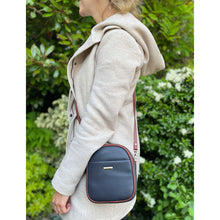 Load image into Gallery viewer, Dark Green &amp; Tan Leather &#39;Poppy&#39; Oval Shaped Twin Zip Top Crossbody Bag (lifestyle)
