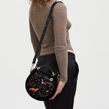 Load image into Gallery viewer, Fable Enchanted Woodland Embroidered Velvet Grab Bag – Black (on model)
